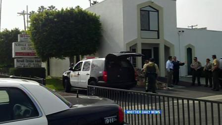Authorities are seen at Norwalk Christian School on Thursday, Feb. 7, 2013.