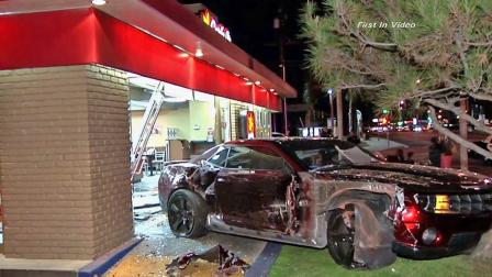 A Chevy Camaro jumped a curb and crashed into a Carls Jr. restaurant in Santa Fe Springs on Wednesday, Feb. 27, 2013.