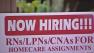 A sign advertizing jobs is seen.
