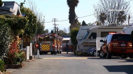 Firefighters are seen investigating a blaze at a mobile home on the 2500 block of South Peck Road in an unincorporated area near Monrovia on Saturday, March 2, 2013.