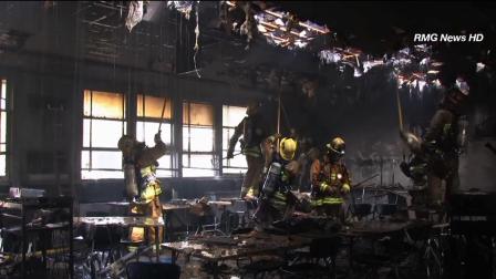 Firefighters are seen battling a blaze at Sun Valley High School located on the 9100 block of Telfair Avenue Sunday, March 3, 2012.