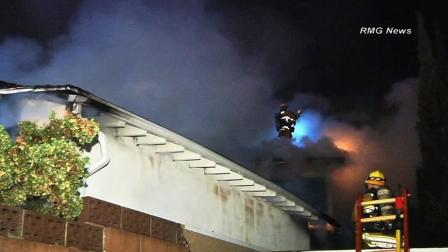 Firefighters are seen battling a fire in the 8600 block of Glencrest Drive in Sun Valley on Saturday, March 16, 2013.