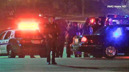 Law enforcement officers are shown during the search for a suspect wanted in the robbery of an Alhambra 7-Eleven store on Saturday, March 16, 2013.