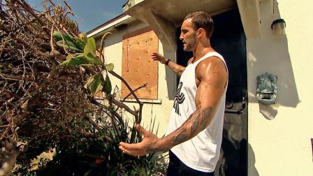 Former WWE superstar Chris The Masterpiece Masters is seen outside his mothers house after a neighbor allegedly set it ablaze on Tuesday, March 19, 2013. Masters saved his mother from the fire by breaking in a window with a tree.