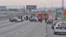 Police are seen on the southbound 110 Freeway in Downtown Los Angeles after a man was shot twice Saturday, March 23, 2013. The freeway was shut down for an investigation.
