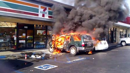 A man was allegedly lit on fire in his vehicle outside a convenience store in Long Beach on Friday, April 12, 2013.