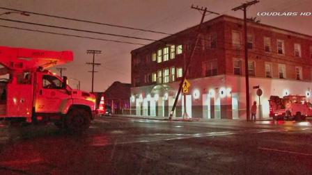 A Department of Water and Power vehicle is shown near the scene of a car crash that caused a power outage in a San Pedro neighborhood on Sunday, April 14, 2013.