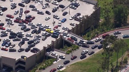 Students and faculty scramble to leave the campus of Cal State Los Angeles after a bomb threat on Thursday, April 18, 2013.