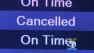 A monitor at LAX shows a flight cancelation.