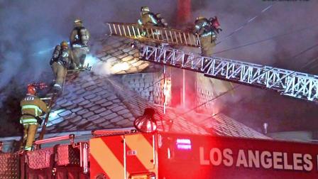 Firefighters battle a fire at a home in the 900 block of North Bonnie Brae Street in Echo Park on Wednesday, April 24, 2013.