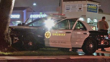 A Los Angeles County Sheriffs Department vehicle is shown slammed into a tree in Lynwood on Friday, April 26, 2013.
