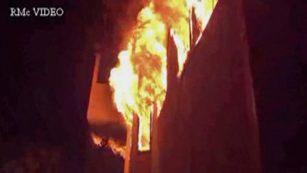 Flames shoot out of a home on Sumac Drive off Beverly Glen Boulevard in Sherman Oaks.