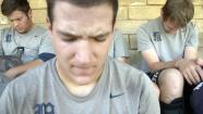 The baseball team for Masters College, a small Christian school, prays before practice.