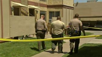 Deputies investigate on Thursday, May 23, 2013, at the Palmdale apartment where an 8-year-old boy was found unconscious.