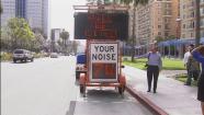 An electronic sign in Long Beach shows the decibel level when a car or a motorcycle passes by on Thursday, May 23, 2013.