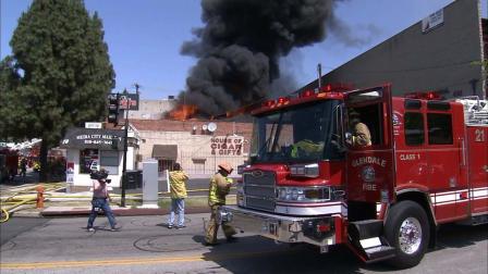 A three-alarm fire erupted at a carpet store near Angeleno Avenue and Glenoaks Boulevard in Burbank Monday, May 27, 2013.