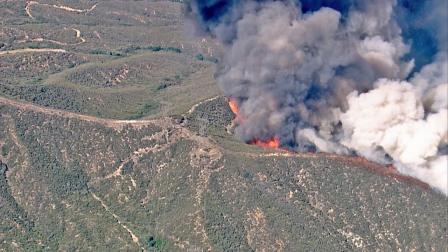 A brush fire burns in Santa Clarita in the Angeles National Forest on Thursday, May 30, 2013.