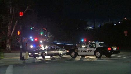 Authorities are seen in Westlake Village following a deputy-involved shooting Saturday, June 15, 2013.