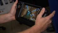 A person demonstrates an electronic game at the Silicon Beach Festival on Wednesday, June 19, 2013.