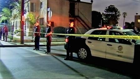 Police are seen near 39th Street and Budlong Avenue where a man was shot and killed Sunday, June 23, 2013.