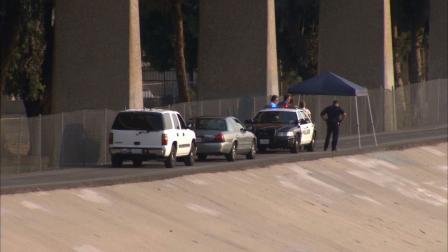 Detectives are seen near the 3500 block of Santa Anita Avenue in El Monte where a man was found stabbed to death Saturday, June 29, 2013.