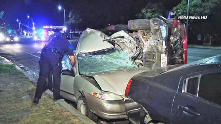 Vehicles are seen following a multi-car crash in Reseda Sunday, June 30, 2013.
