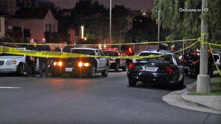 A heavy police presence is seen in the 1200 block of West 15th Street in San Pedro after a standoff with suspects Sunday, June 30, 2013.