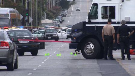 An alleged armed and dangerous suspect was shot and killed by Los Angeles police officers on the 1200 block of Van Nuys Boulevard in Pacoima Sunday, June 30, 2013.