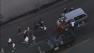 Protesters jump on a car in the Crenshaw District on Monday, July 15, 2013.