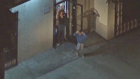 Churchgoers are brought out with their hands up in the Pico-Union District after a fatal officer-involved shooting on Tuesday, July 15, 2013.