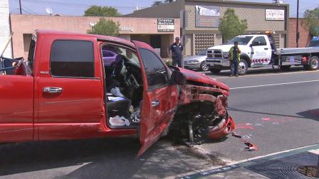 A police pursuit came to an end after the suspect vehicle, the red pickup truck seen in this photo, crashed on Burbank Boulevard near Lima Street on Saturday, Aug. 3, 2013.