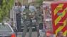 Armed police officers are shown at the scene of a reported shooting on the 3300 block of Bayview Drive in Manhattan Beach on Saturday, August 10, 2013.