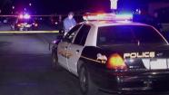 Police investigate one of four shootings that left three people dead in Pomona Sunday, Aug. 11, 2013.