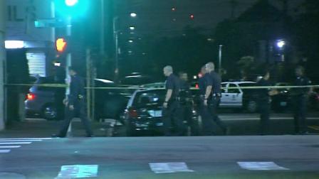 Authorities investigate an officer-involved shooting in a laundromat at 43rd Street and Vermont Avenue in South Los Angeles on Wednesday, Sept. 11, 2013.