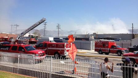 Firefighters are seen battling a blaze at a one-story commercial building at 10680 Elkwood Street in Sun Valley, Saturday, Sept. 14, 2013.