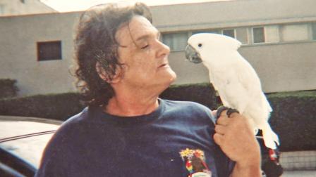 Walfrid Whittington and his service bird, Laura, are shown in this undated file photo.