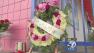 A makeshift memorial of flowers and candles are shown outside the Happy Bargain 99 Cent Store at 74th Street and Broadway in South Los Angeles on Wednesday, Sept. 18, 2013.