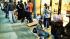 Some people waiting in line for the iPhone 5S or...