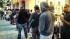 Some people waiting in line for the iPhone 5S or...