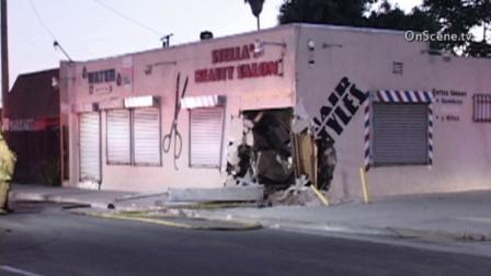 A silver sedan slammed into a Lexus with two women inside before crashing into a beauty salon in Compton Sunday, Sept. 23, 2013.