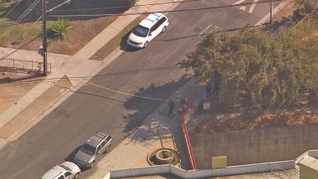 Crime tape ropes off the scene of a deputy-involved shooting in the Mid-City area on Wednesday, Sept. 25, 2013.
