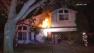 Firefighters work to put out a house fire in Cerritos in the 19400 block of Jacob Avenue on Thursday, Oct. 3, 2013.