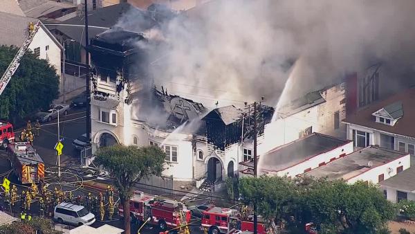 Firefighters battle a fire at a historic church in Los Angeles on Tuesday, Oct. 8, 2013.
