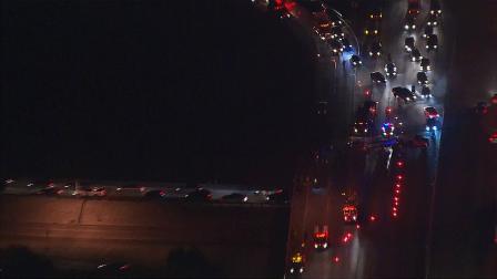 Back up is seen after a trash truck overturned on the westbound 60 Freeway in Industry on Monday, Oct. 14, 2013.
