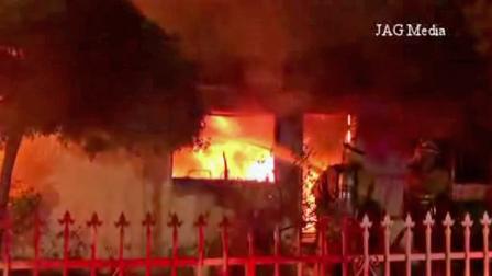 Flames rip through a home in the 6900 block of Agnes Avenue in North Hollywood on Wednesday, Oct. 16, 2013.