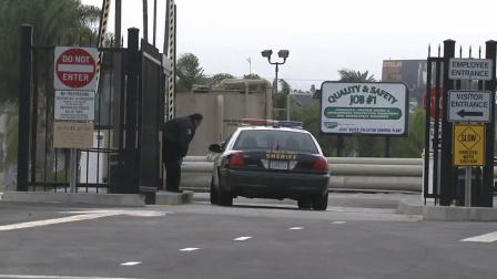 A Los Angeles County Sheriffs Department patrol cruiser is seen at the entrance of a Carson facility where human remains were found on Saturday, Oct. 26, 2013.