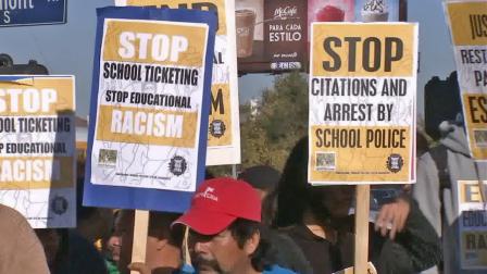 Members of the Community Rights Campaign and its supporters marched near Manual Arts High School on Wednesday, Oct. 30, 2013, accusing the Los Angeles School District and its police of targeting black and Latino students.