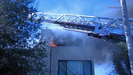 Black smoke billows into the air from an apartment fire at Freedom Drive and Liberty Bell Road in Calabasas on Saturday, Nov. 2, 2013.