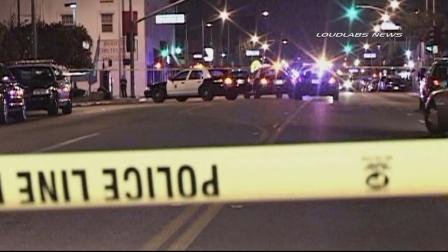 Authorities investigate a fatal officer-involved shooting in the area of Anaheim Street and Magnolia Avenue in Long Beach on Sunday, Nov. 10, 2013.