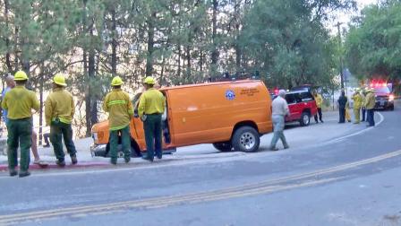 Emergency officials gather at Angeles National Forest near Hermit Falls, where a student hiker died after jumping into a pool of water on Monday, Nov. 11, 2013.
